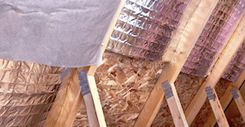 Gable View of Ongoing House Attic insulation Project with Heat a