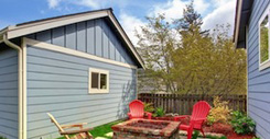 Backyard With Fire Pit And Deck Chairs