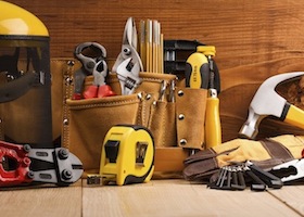 set of working tools on wooden boards