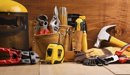 set of working tools on wooden boards