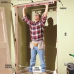 Guy measuring to install a door