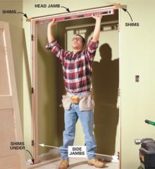 Guy measuring to install a door