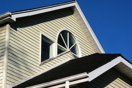 fragment of a house with vinyl gutters