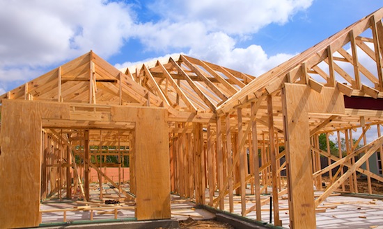 American residential wooden house construction detail in blue sunny day sky